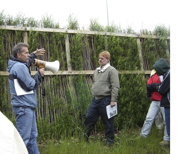 Photo of Michel Labrecque presenting a vegetal sound barrier wall