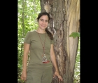 Photo of Édith Bégin in front of a split tree